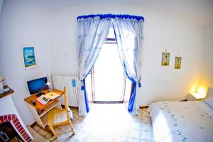 Postel nebo postele na pokoji v ubytování B&B La Muraglia