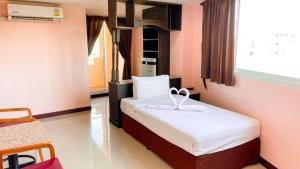 a bedroom with a bed in a room at AA Pattaya Ville in Pattaya Central +27 photos
