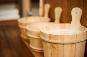 a row of wooden buckets lined up on a table at LIHO - einfach Lübeck in Lübeck