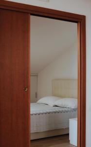 a bedroom with a bed through a glass door at Villa Largo Belvedere in Campomarino