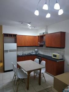Kuchyň nebo kuchyňský kout v ubytování Urban comfortable apartment