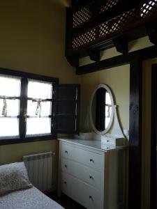 A bed or beds in a room at Mayorazgo De Altamira Mila