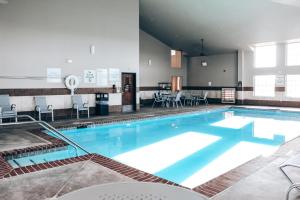 a large swimming pool in a hotel room at Holiday Inn Express Hotel and Suites Weatherford, an IHG Hotel in Weatherford