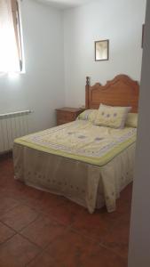 A bed or beds in a room at El Molino de la laguna