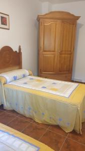 A bed or beds in a room at El Molino de la laguna