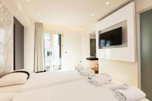Posteľ alebo postele v izbe v ubytovaní Kahlua Boutique Hotel