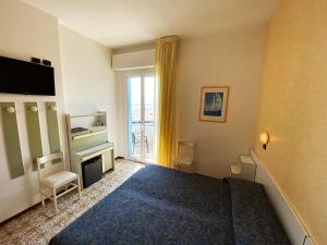Postel nebo postele na pokoji v ubytování Hotel Levante