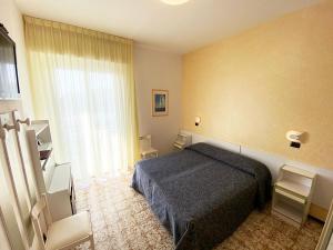 Postel nebo postele na pokoji v ubytování Hotel Levante