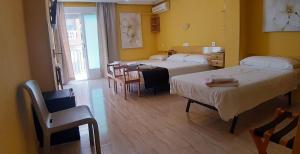 Postel nebo postele na pokoji v ubytování Hotel Alaska