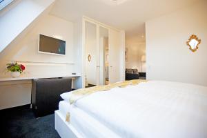 Ein Bett oder Betten in einem Zimmer der Unterkunft Hotel Krone OHG