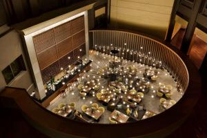 an overhead view of a dining table with lights at Wyndham Grand Athens in Athens