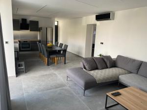 a living room with a couch and a table at SPA Apartment Vito in Vodice