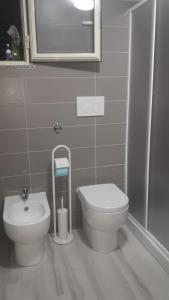 a bathroom with a toilet and a sink and a shower at Villa Maria in Marconia +57 photos