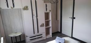 a room with white cabinets and a mirror at Casa Roiz in Santillana del Mar