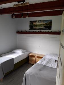 Posteľ alebo postele v izbe v ubytovaní Apartament Fenowe Wzgórze