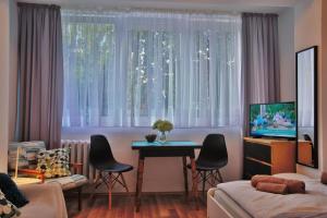 TV a/nebo společenská místnost v ubytování Friendly Place Doki