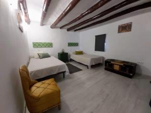 Ένα ή περισσότερα κρεβάτια σε δωμάτιο στο Alma Mudéjar Casa Rural