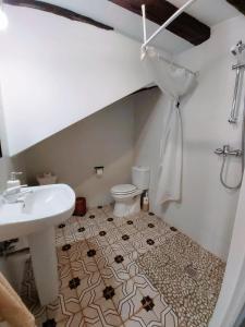 a bathroom with a sink and a toilet at Alma Mudéjar Casa Rural in Munébrega