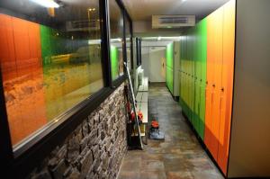 a hallway with brightly colored doors and a room with a hallway at Hotel Cristina in Pas de la Casa