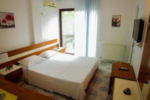 Ένα ή περισσότερα κρεβάτια σε δωμάτιο στο Vila Mihai Eminescu