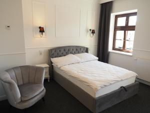 Łóżko lub łóżka w pokoju w obiekcie Apartamenty Stary Browar Oleśnica