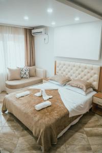 מיטה או מיטות בחדר ב-Hotel Ajana