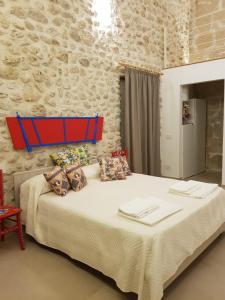 Posteľ alebo postele v izbe v ubytovaní Casa Vacanze Brezza di Gaffe