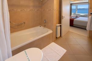 Postel nebo postele na pokoji v ubytování Hotel Tirol
