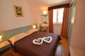 Posteľ alebo postele v izbe v ubytovaní Apartments Materada Residence