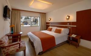 Postel nebo postele na pokoji v ubytování Hotel Tirol