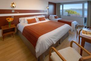 Postel nebo postele na pokoji v ubytování Hotel Tirol