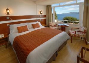 Postel nebo postele na pokoji v ubytování Hotel Tirol