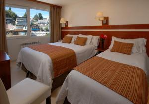 Postel nebo postele na pokoji v ubytování Hotel Tirol