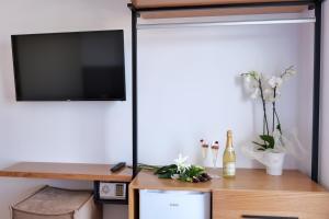TV a/nebo společenská místnost v ubytování NOI HOTEL
