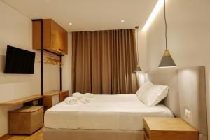 Postel nebo postele na pokoji v ubytování NOI HOTEL