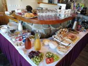 a table with a buffet of food and drinks at Hotel Zlatý Orel in Ostravice