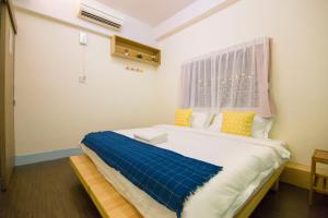 Letto o letti in una camera di One Heart Inn