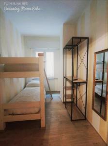 Postel nebo postele na pokoji v ubytování Dreaming Piazza Erbe Rooms