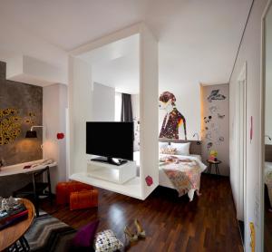 A television and/or entertainment centre at ARTOTEL Thamrin Jakarta