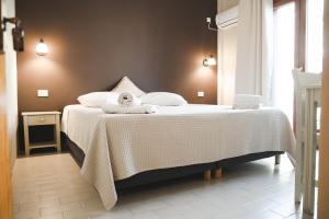 a bedroom with a bed with a teddy bear on it at Sisiotisa in Argostoli