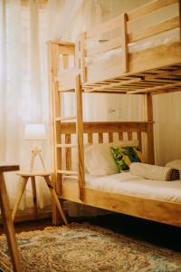 a bedroom with two bunk beds and a lamp at Mambo Hideaway in Arusha