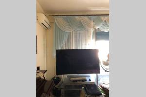 A television and/or entertainment centre at CAPO PELORO RELAX