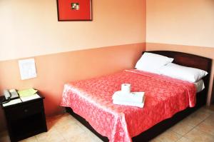 Postel nebo postele na pokoji v ubytování GV Tower Hotel