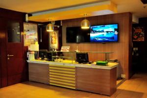 TV a/nebo společenská místnost v ubytování GV Tower Hotel