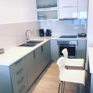 Kuchyň nebo kuchyňský kout v ubytování Calma apartment