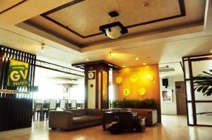 a lobby with a couch and a table in a building at GV Tower Hotel in Cebu City