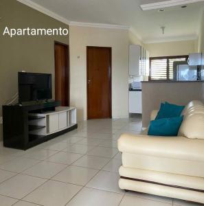 TV a/nebo společenská místnost v ubytování Muriú Beach Flat