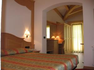 Postel nebo postele na pokoji v ubytování Hotel Regent's