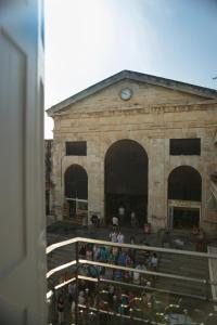 a group of people sitting in front of a building at Elia Daliani in Chania