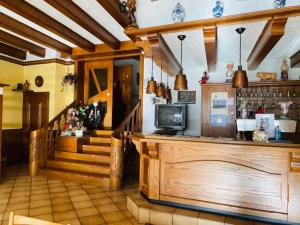 a shop with a counter and a staircase in a room at Gasthaus Castor in Klotten